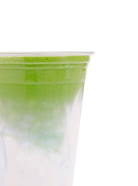 istock Refreshing green beverage in clear cup on a bright background 2234810325