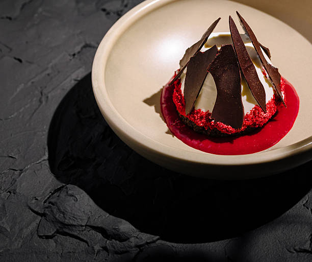 istock Unique dessert presentation featuring layers of red and chocolate elements 2234810364