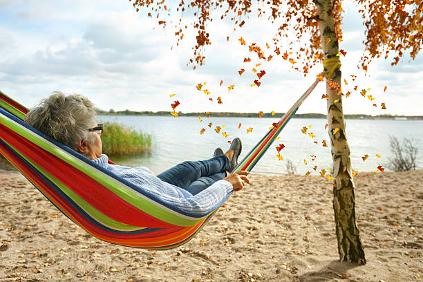 istock Autumn Calm: Relaxing in a Hammock with a view of the lake 2234810421