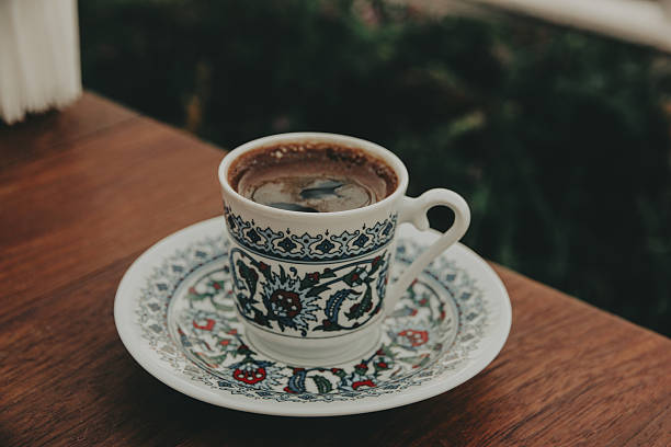 istock Fragrant Turkish coffee in a traditional patterned porcelain small cup, served on a saucer. Rich culture, comfort, and warmth of the East in every detail. Perfect for food and travel content. 2234812627