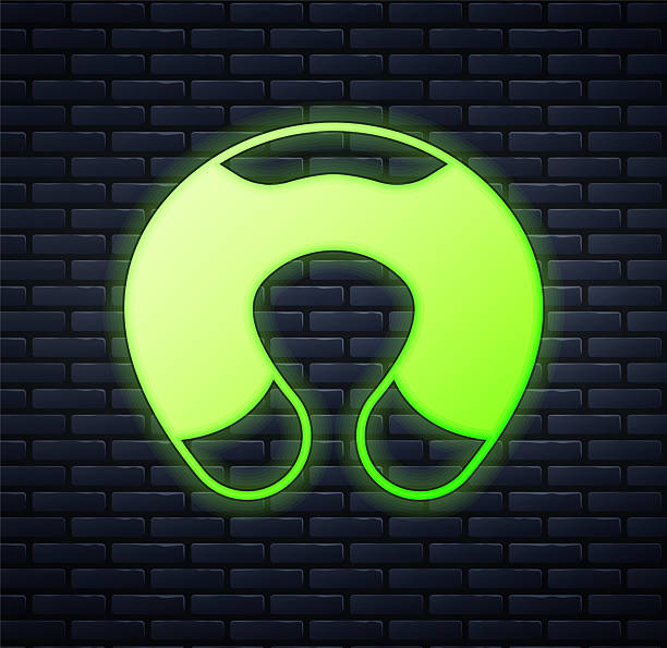 istock Glowing neon Travel neck pillow icon isolated on brick wall background. Pillow U-shaped. Vector 2234813197