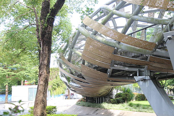 istock a parametric steel and bamboo sphere-shaped structure with curved metal beams wrapped around it 2234814245