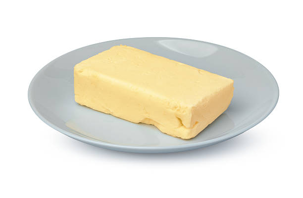 Butter in plastic container with knife
