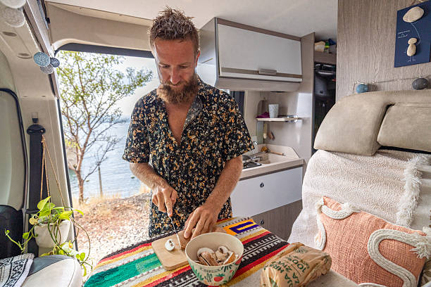 istock Man Slicing Mushrooms on Cutting Board Indoors 2234815961