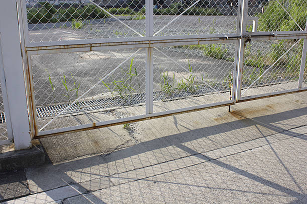 istock Vacant lot and chain link fence 2234816100