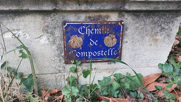 istock ancient road sign towards compostella 2234819768