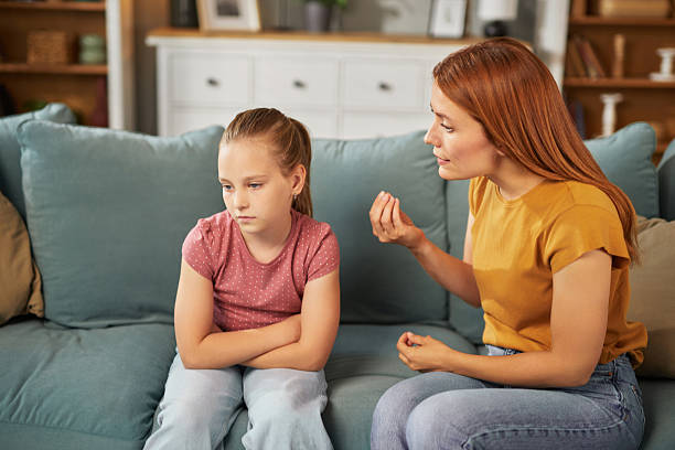 istock Mother scolding daughter at home after misbehavior 2234820539