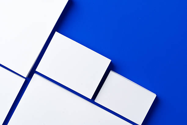 istock Blank white businesscards on classic blue background 2234821614