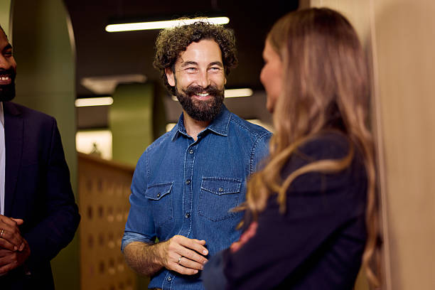 istock Business Professionals Engaging in a Friendly Conversation at the Workplace 2234821703