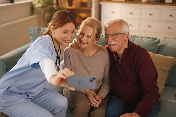 istock Nurse taking selfie with elderly couple at home 2234821849