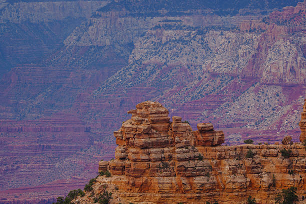 Majestic red rock canyon formations with layered cliffs and rugged textures. Scenic desert landscape showcasing natural erosion, geological beauty, and timeless wilderness.