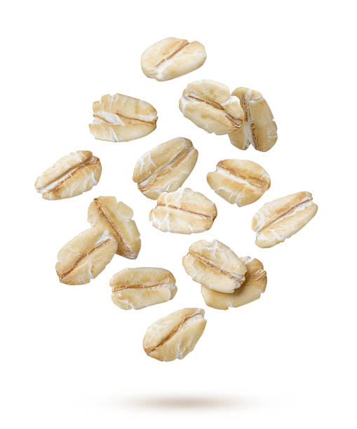istock Oat flakes flying close-up on a white. Isolated 2234825775