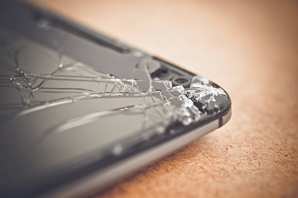 istock Shattered smartphone screen lying on surface, revealing potential repair costs and device vulnerability from accidental damage 2234826242
