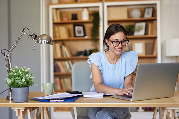 istock Young woman working from home office using laptop 2234827139