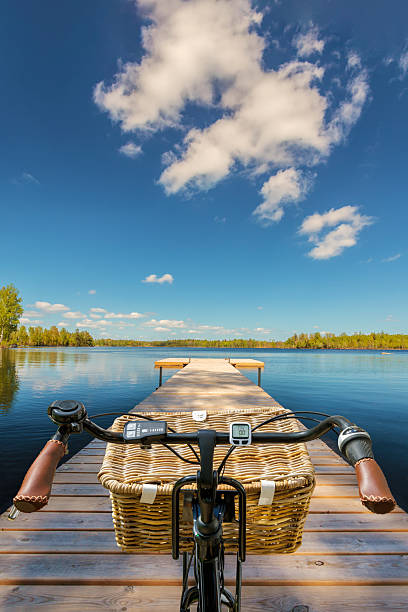 Electric bicycle on a wooden jetty on a sunny day in the province of Smaland in Sweden