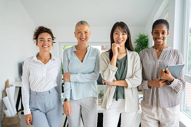 istock Diverse group of businesswomen collaborating in a bright modern office environment 2234831382