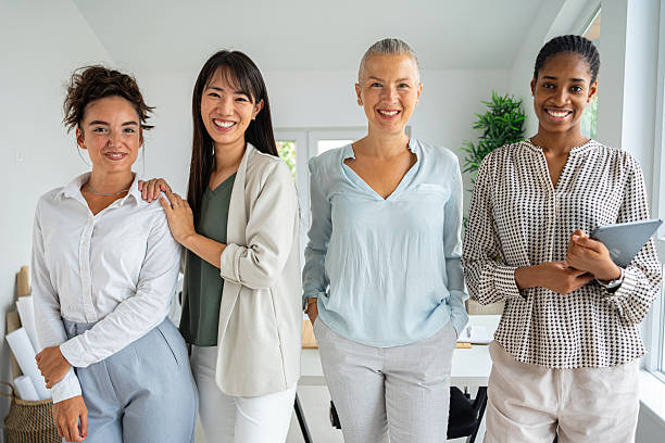 istock Group of professional women smiling in a bright and modern office setting 2234831448