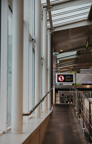 istock Airport hallway with signage and restricted access area 2234835080