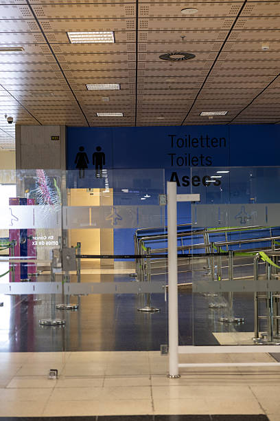 istock Interior airport area with restroom signage in multiple languages 2234835093