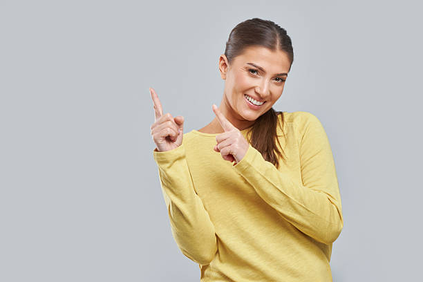 istock Photo of woman making expression with hands on background 2234835277