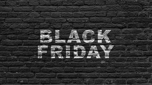 istock Closeup view of Black Friday text on a black wall background. Copy space. Flat lay. Black Friday sale concept 2234836617