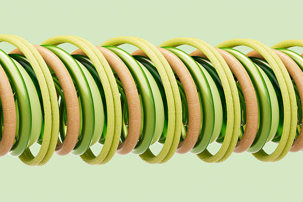A digitally generated image featuring twisting green-colored tubes, symbolizing growth, energy flow, and environmental harmony. The abstract structure conveys themes of sustainability, eco-friendly technology, and green innovation, making it ideal for editorial or promotional use in renewable energy, environmental initiatives, and green tech branding.