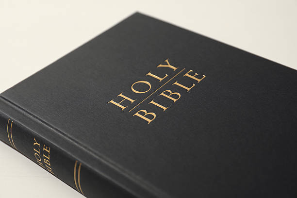 istock Hardcover Holy Bible on white table, closeup 2234839295