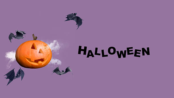 istock Jack-o'-Lantern or Halloween pumpkin with flying bats on a colored background. Collage art of Halloween 2234839719