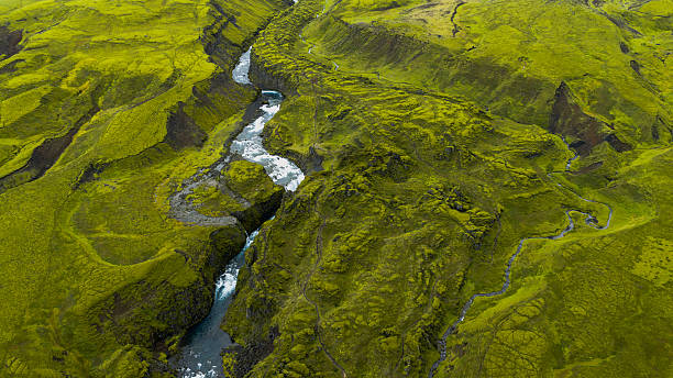 istock Aerial View of Winding River Through Rugged Icelandic Terrain 2234840251