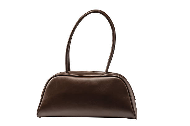 Bowling browm leather bag isolated on a white background. Women trendy bag.