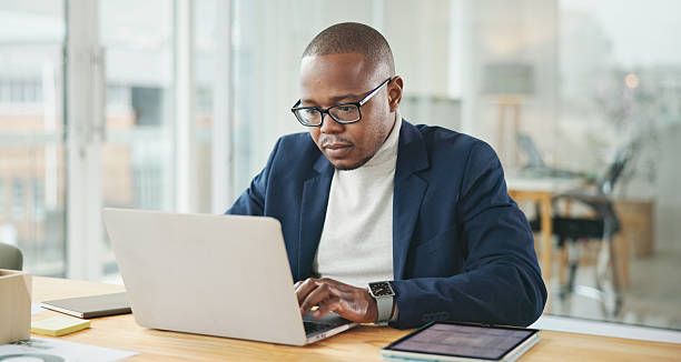 istock Professional Person Working in a Modern Office Setting on a Laptop 2234841205