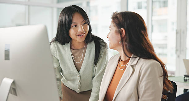 istock Two Professional Women Collaborating at Work in a Bright Modern Office 2234841267