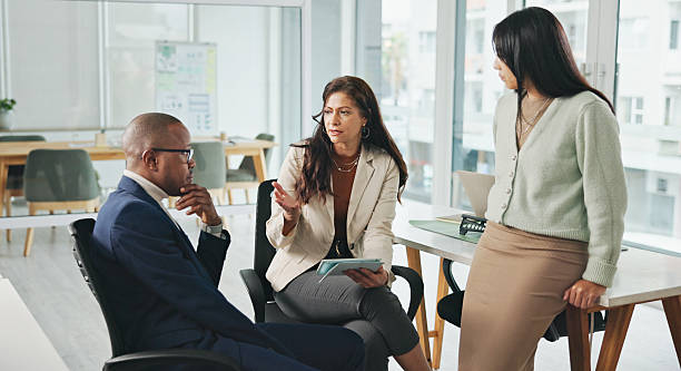istock Professional Team Engaged in Discussion in a Modern Office Setting 2234841292
