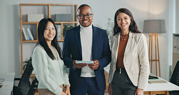 istock Professional Team Smiling and Standing Together in a Modern Office Setting 2234841306
