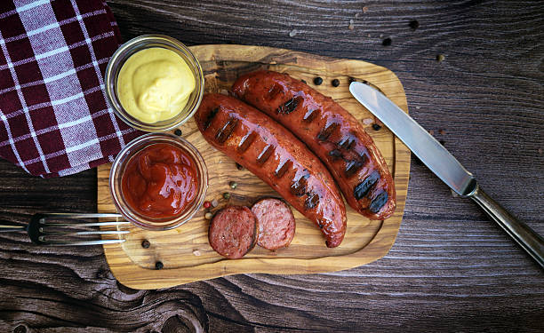 istock Delicious roasted wurst sausages on wooden  table 2234841779