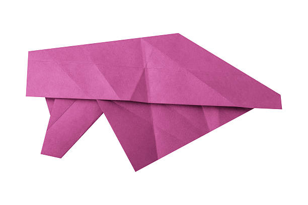 Pink crumpled paper isolated on white background