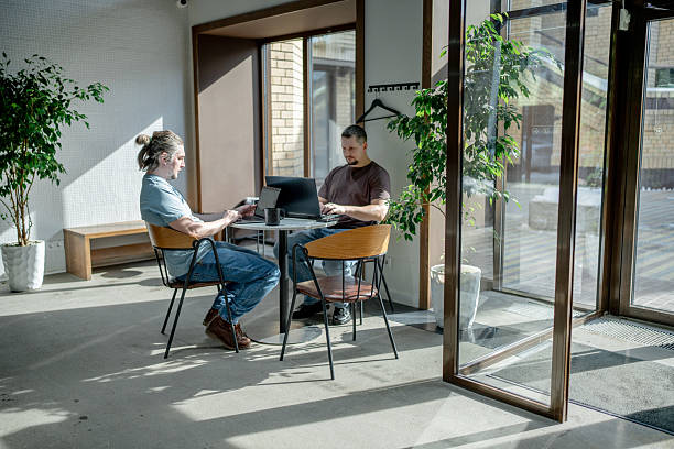istock Programmers discussing over laptop working at startup. Office, business and friends together in teamwork with notebook, laptop and coffee workplace 2234843116