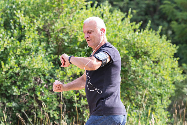 istock Jogger enjoying nature while monitoring workout stats 2234843298