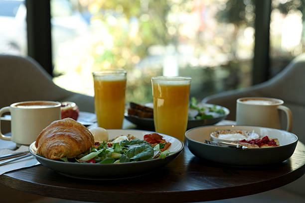 istock Tasty breakfast. Different meals and drinks served on wooden table in cafe 2234843553