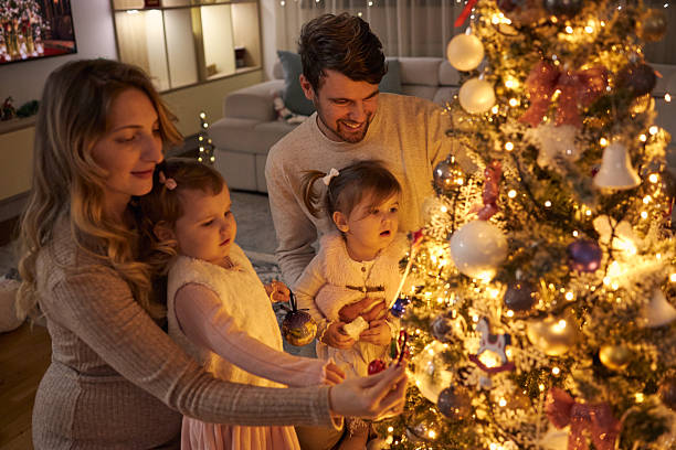 istock Beautiful family decorating Christmas tree 2234845541