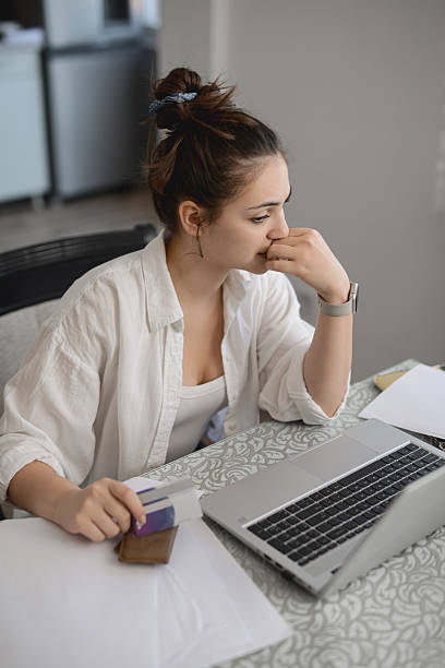 istock Concerned Woman Looking Stressed While Facing Issues Paying Bills Online From Home 2234845707