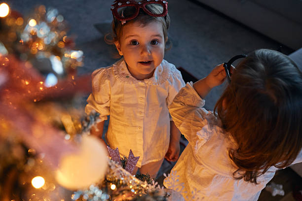 Photo of a beautiful twin sisters on Christmas Eve.