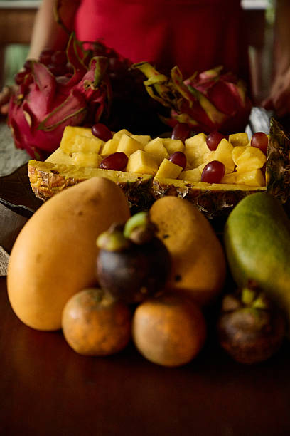 Assorted exotic fruits with pineapple, dragon fruit, and grapefruits displayed together