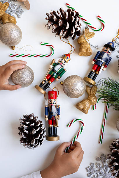 Festive arrangement with nutcrackers, ornaments, and pine cones