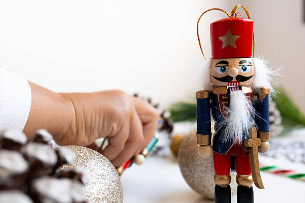 istock Nutcracker decoration with holiday ornaments and pine cones 2234850118