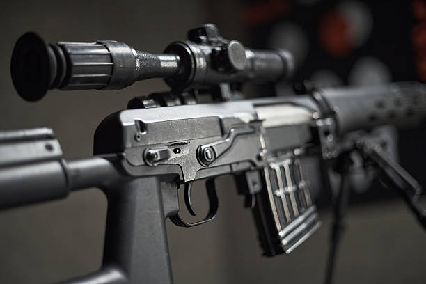 istock Close up of Modern Sniper Rifle with Scope Displaying Tactical Equipment 2234850201
