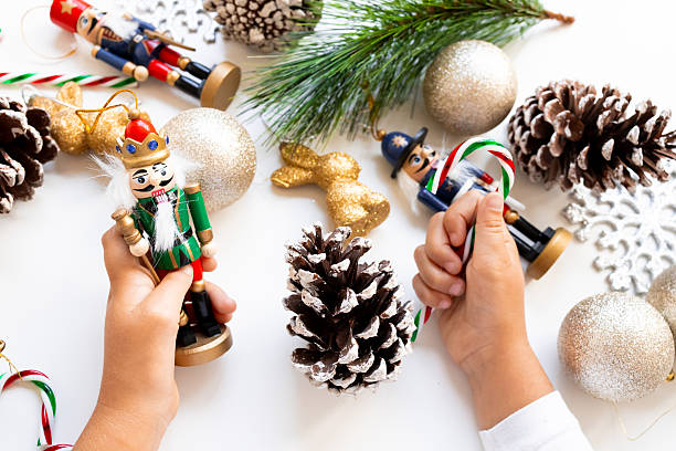 istock Child hands decorating with nutcracker and Christmas ornaments 2234850556