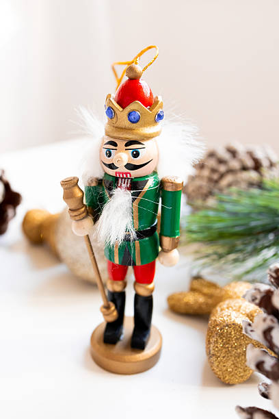 istock Festive wooden nutcracker ornament with crown and scepter on holiday display 2234850564