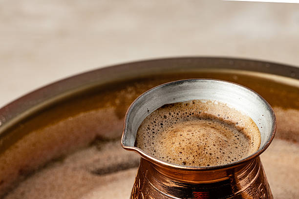 istock Copper turk with coffee brewing in sand 2234850762