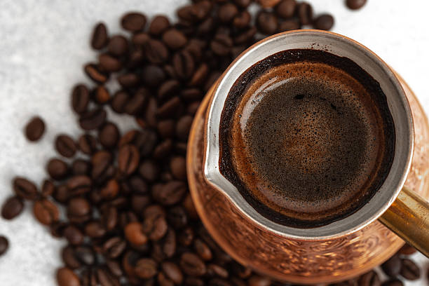 istock Close up of copper coffee turk on light textured surface 2234853451